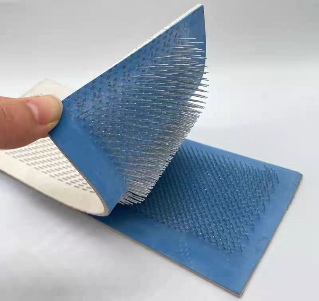 Hair comb needle plate